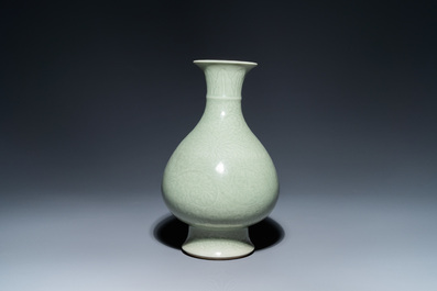 A Chinese monochrome celadon-glazed 'yuhuchunping' vase with underglaze floral design, Kangxi mark, 19th C.
