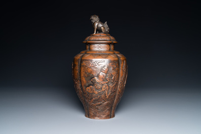 A Japanese hammered brass vase and cover, Meiji, 19th C.