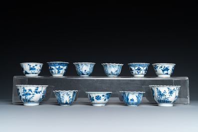 Twenty-three Chinese blue and white saucers and seventeen cups, Kangxi