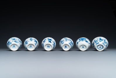 Twenty-three Chinese blue and white saucers and seventeen cups, Kangxi