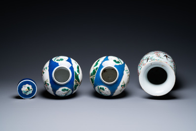 A Chinese famille rose vase and a pair of famille verte powder blue-ground jars, 19th C.