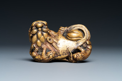 A Chinese gilt bronze 'lion with cubs' scroll weight, Qing