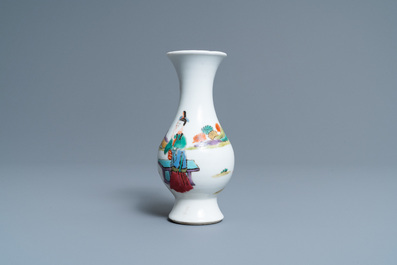 A Chinese famille rose vase with a man and a woman in a garden, Yongzheng