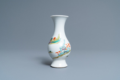 A Chinese famille rose vase with a man and a woman in a garden, Yongzheng