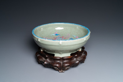 A Chinese enamelled celadon-glazed censer with a dragon on a lotus-shaped wooden stand, Qing