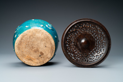 A Chinese monochrome turquoise-glazed bowl with reticulated wooden cover, Ming
