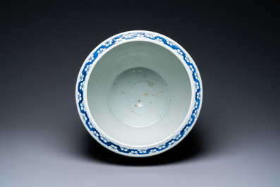 A Chinese blue and white 'dragons' fish bowl, Qianlong/Jiaqing