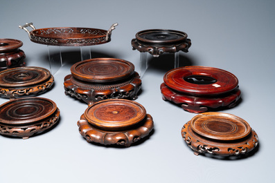 A varied collection of Chinese wooden stands and a silver-mounted tray, 19/20th C.