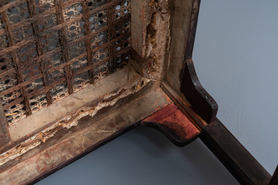 A pair of Chinese carved wooden chairs with wicker seats, 19th C.