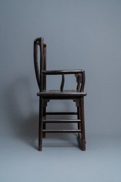 A pair of Chinese carved wooden chairs with wicker seats, 19th C.