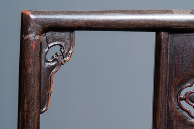 A pair of Chinese carved wooden chairs with wicker seats, 19th C.