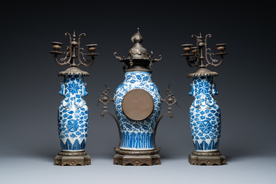 A Chinese bronze-mounted three-piece blue and white clock garniture, 19th C.