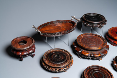 A varied collection of Chinese wooden stands and a silver-mounted tray, 19/20th C.