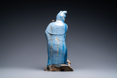 A large Chinese blue-glazed Shiwan pottery 'immortal' figure, 19th C.