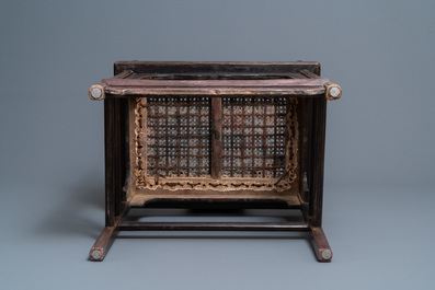 A pair of Chinese carved wooden chairs with wicker seats, 19th C.