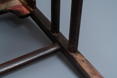 A pair of Chinese carved wooden chairs with wicker seats, 19th C.