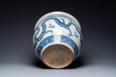 A Chinese blue and white 'dragons' fish bowl, Qianlong/Jiaqing