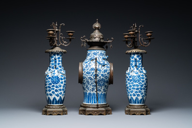 A Chinese bronze-mounted three-piece blue and white clock garniture, 19th C.