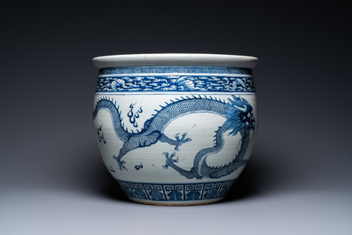 A Chinese blue and white 'dragons' fish bowl, Qianlong/Jiaqing