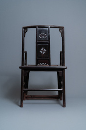 A pair of Chinese carved wooden chairs with wicker seats, 19th C.