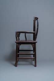 A pair of Chinese carved wooden chairs with wicker seats, 19th C.