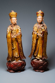 A pair of large Chinese or Vietnamese gilded, lacquered and painted wooden figures, 18/19th C.