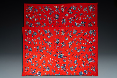 An exceptional large Chinese red-ground felt cloth with silk embroidery of blue and white flowers and peaches, 18/19th C.