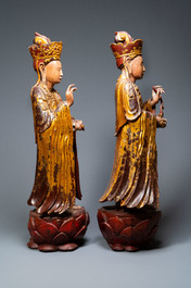 A pair of large Chinese or Vietnamese gilded, lacquered and painted wooden figures, 18/19th C.