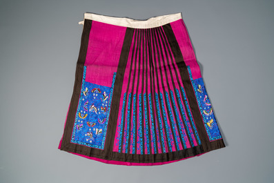 A Chinese embroidered silk jacket, a skirt and a sleeve fragment, Qing