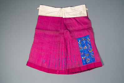 A Chinese embroidered silk jacket, a skirt and a sleeve fragment, Qing