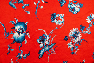 An exceptional large Chinese red-ground felt cloth with silk embroidery of blue and white flowers and peaches, 18/19th C.