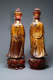 A pair of large Chinese or Vietnamese gilded, lacquered and painted wooden figures, 18/19th C.