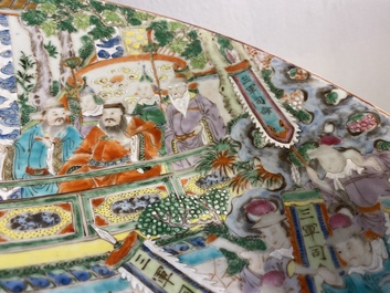 A large Chinese Canton famille rose 'horseriders' dish, 19th C.