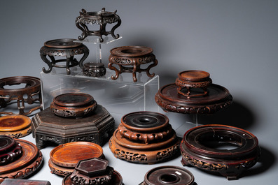 A varied collection of Chinese wooden stands, 19/20th C.