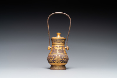 A Chinese gold-leaf-decorated cast iron vase and cover, probably 19th C.