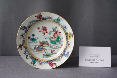 A Chinese famille rose plate with mandarin ducks in a lotus pond and immortals, Yongzheng