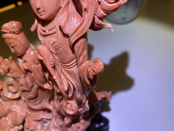 A Chinese carved red coral 'Guanyin and servant' group, 19/20th C.