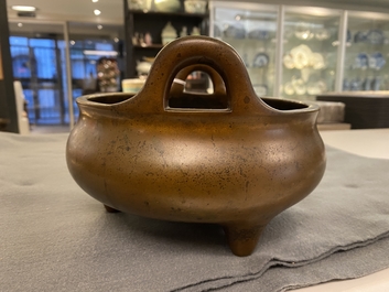 A Chinese bronze tripod censer, Xuande mark, 18th C.