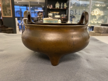 A Chinese bronze tripod censer, Xuande mark, 18th C.