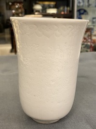 A Chinese white-glazed anhua-decorated 'peony' cup, Xuande mark, Kangxi