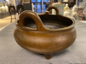 A Chinese bronze tripod censer, Xuande mark, 18th C.