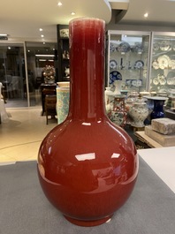 Two Chinese monochrome sang de boeuf bottle vases, 19/20th C.