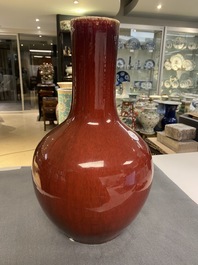 Two Chinese monochrome sang de boeuf bottle vases, 19/20th C.