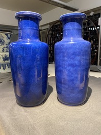A pair of Chinese monochrome powder blue rouleau vases, Kangxi