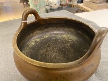 A Chinese bronze tripod censer, Xuande mark, 18th C.