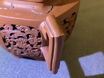 A Chinese reticulated double-walled Yixing stoneware teapot and cover, Kangxi