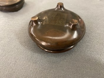 A Chinese enamelled silver figure, a silver vase, a silver-inlaid bronze censer and a silver-plated bronze box, 19/20th C.