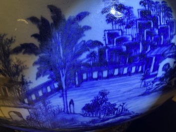 A large Chinese blue and white fish bowl with landscape design, Qianlong