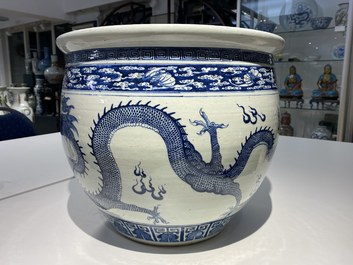 A Chinese blue and white 'dragons' fish bowl, Qianlong/Jiaqing