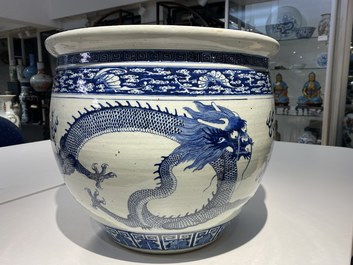 A Chinese blue and white 'dragons' fish bowl, Qianlong/Jiaqing